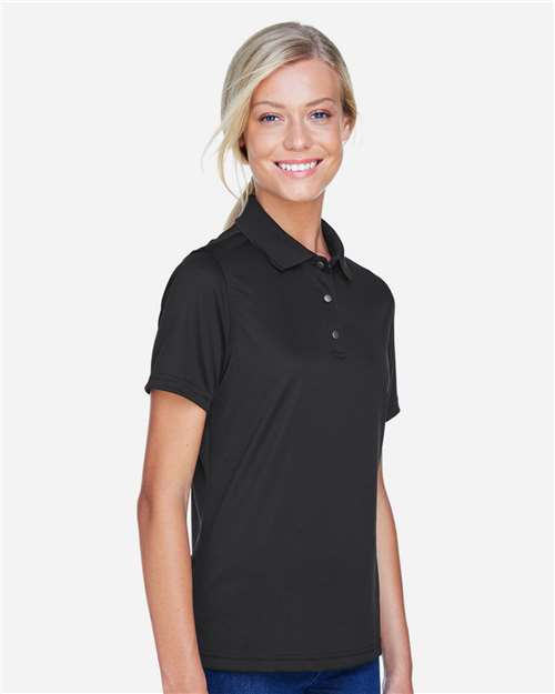 Harriton M345W Women's Advantage Snag Protection Plus IL Snap Placket Polo in Black